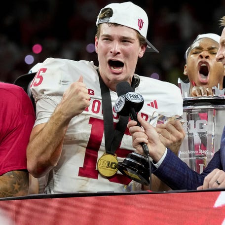 Indiana quarterback Fernando Mendoza (15) celebrates after his team's defeat of Ohio State in the 2025 Big Ten championship game at Lucas Oil Stadium in Indianapolis.