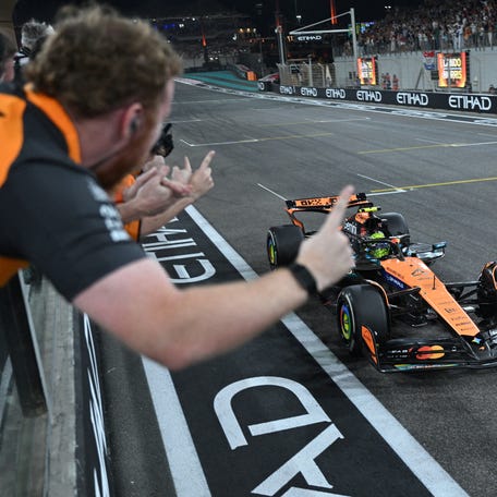McLaren's Lando Norris celebrates after finishing in third place at the Abu Dhabi Grand Prix to become the 2025 Formula One World Champion.