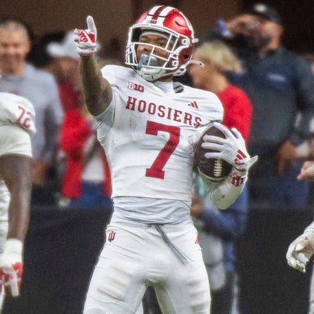 Indiana wide receiver E.J. Williams (7) celebrates a first down against Ohio State during the 2025 Big Ten championship game at Lucas Oil Stadium on Saturday, Dec. 6, 2025.