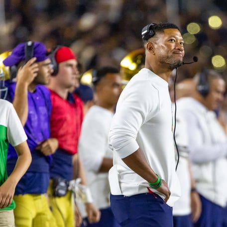 Sep 13, 2025; South Bend, Indiana, USA; Notre Dame Fighting Irish head coach Marcus Freeman looks at the scoreboard during the second half against the Texas A&M Aggies at Notre Dame Stadium. Mandatory Credit: Michael Caterina-Imagn Images