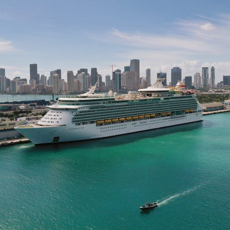 An aerial view from a drone shows Royal Caribbean's Navigator of the Sea cruise ship docked on March 2, 2021 in Miami, Florida.