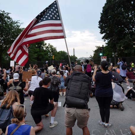Protesters kneel near the White House on June 4, 2020, in Washington, DC, to protest the Minneapolis police killing of George Floyd.
