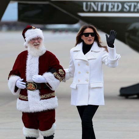 U.S. first lady Melania Trump waves as she arrives to attend the annual Marine Toys for Tots Drive hosted by the United States Marine Corps Reserve, at Marine Corps Base Quantico in Quantico, Virginia on Dec. 8, 2025.