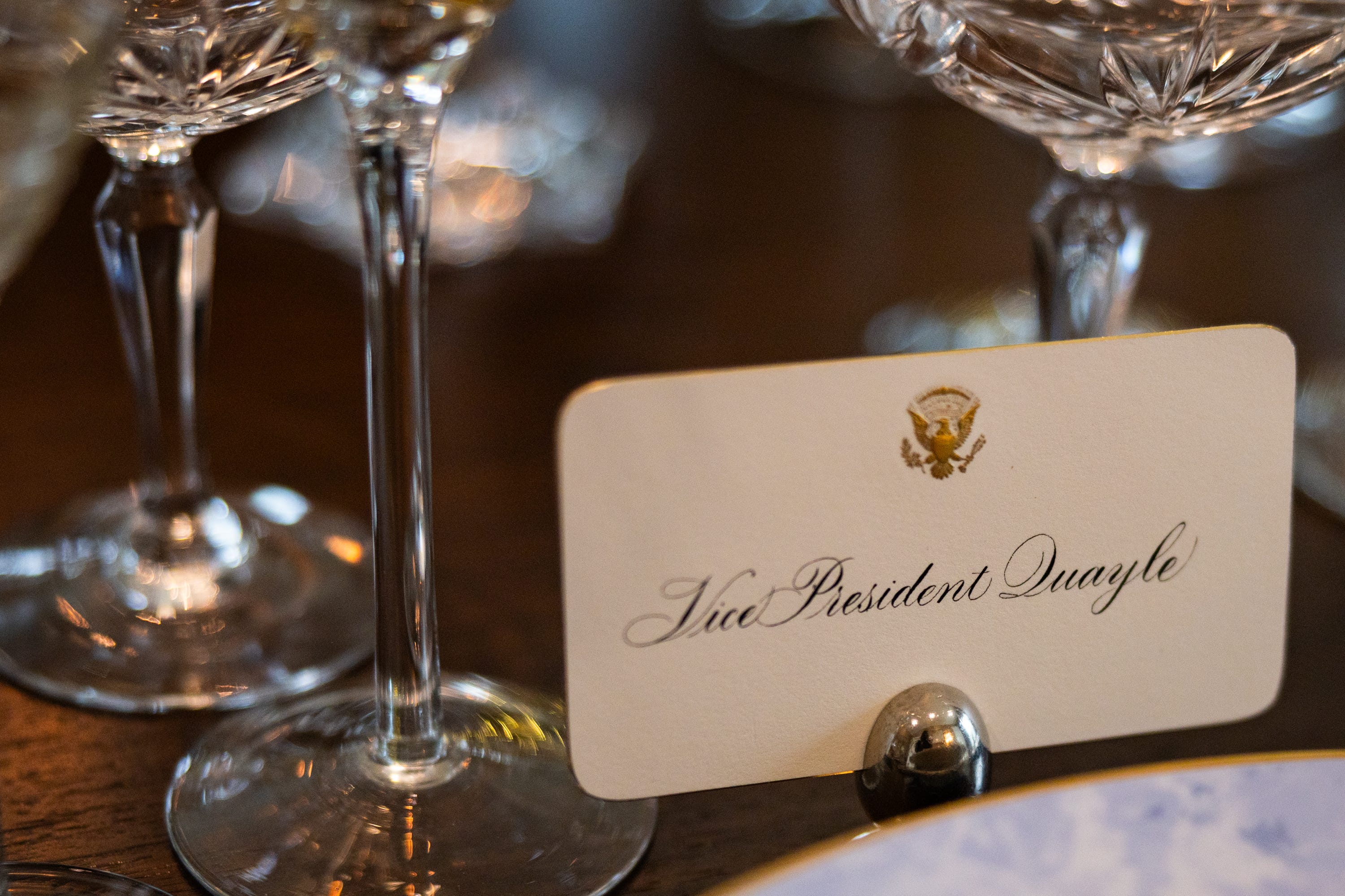 A faux seating chart featuring past presidents, vice presidents, and their families is laid out among the dinnerware as part of the holiday decorations at the vice president’s residence on the grounds of the Naval Observatory on Dec. 8, 2025.