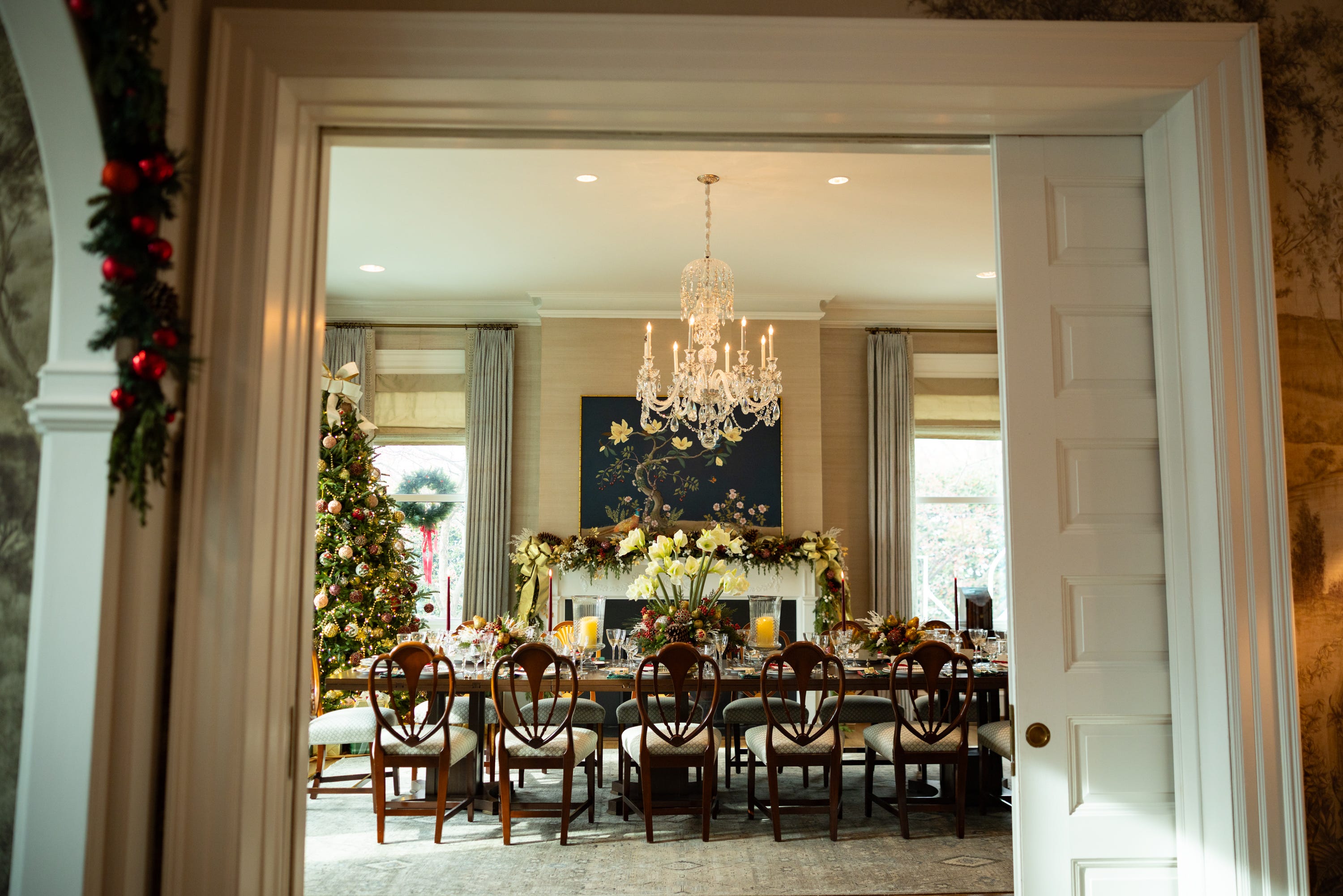 A faux seating chart featuring past presidents, vice presidents, and their families is laid out among the dinnerware as part of the holiday decorations at the vice president’s residence on the grounds of the Naval Observatory on Dec. 8, 2025.