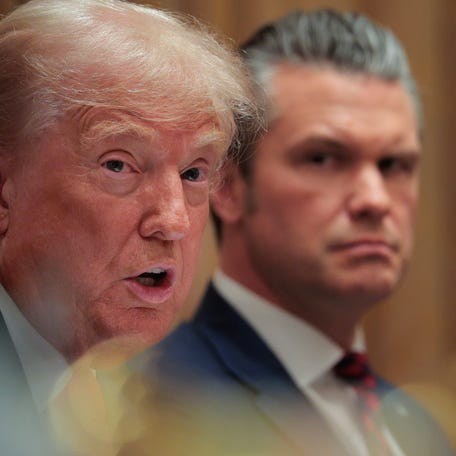 President Donald Trump and Defense Secretary Pete Hegseth at a Cabinet meeting in the White House on Dec. 02, 2025.