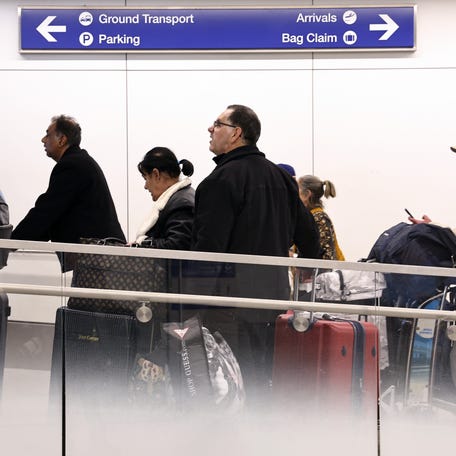 LOS ANGELES, CALIFORNIA - DECEMBER 26: Travelers walk with their luggage as they depart the Tom Bradley International Terminal at Los Angeles International Airport (LAX) following the Christmas holiday on December 26, 2024 in Los Angeles, California.