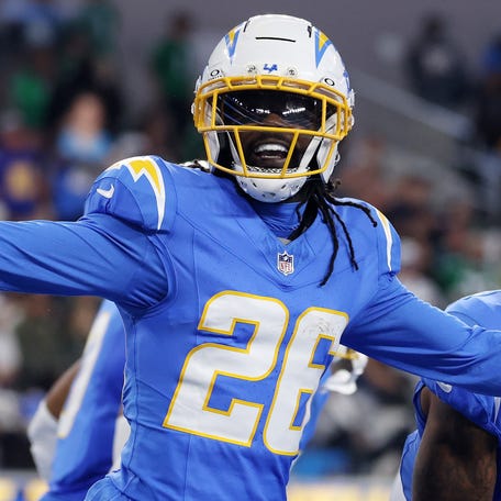 Donte Jackson celebrates after an interception against the Eagles.