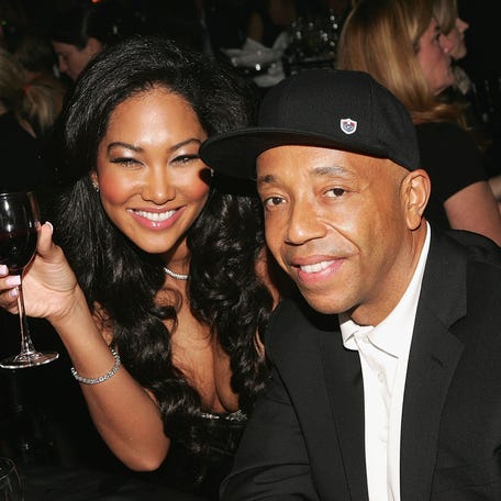 Kimora Lee Simmons and Russell Simmons pose for a photo at The Black Ball, presented by Conde Nast Media Group and hosted by Alicia Keys and Iman to benefit Keep a Child Alive, at Hammerstein Ballroom Nov. 9, 2006, in New York City.