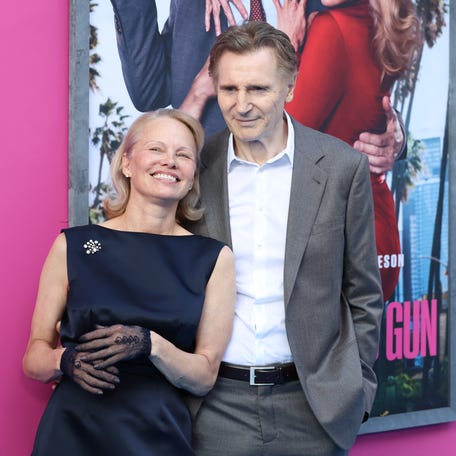 Pamela Anderson and Liam Neeson attend the premiere of "The Naked Gun" in New York City on July 28, 2025.