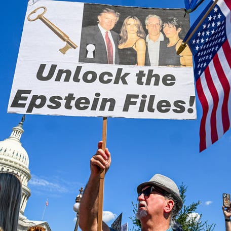 Demonstrators carry signs in support of the victims of sex offender Jeffrey Epstein and his accomplice Ghislaine Maxwell near a press conference held by US representatives outside the U.S. Capitol in Washington, DC on Sept. 3, 2025.