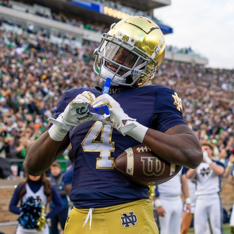 Nov 22, 2025; South Bend, Indiana, USA; Notre Dame Fighting Irish running back Jeremiyah Love (4) celebrates scoring against the Syracuse Orange during the first half at Notre Dame Stadium.
