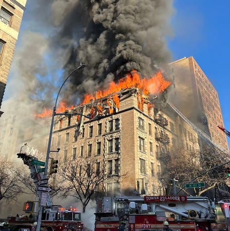 FDNY fights a fire in manhattan that caused the roof of an apartment building to collapse.
