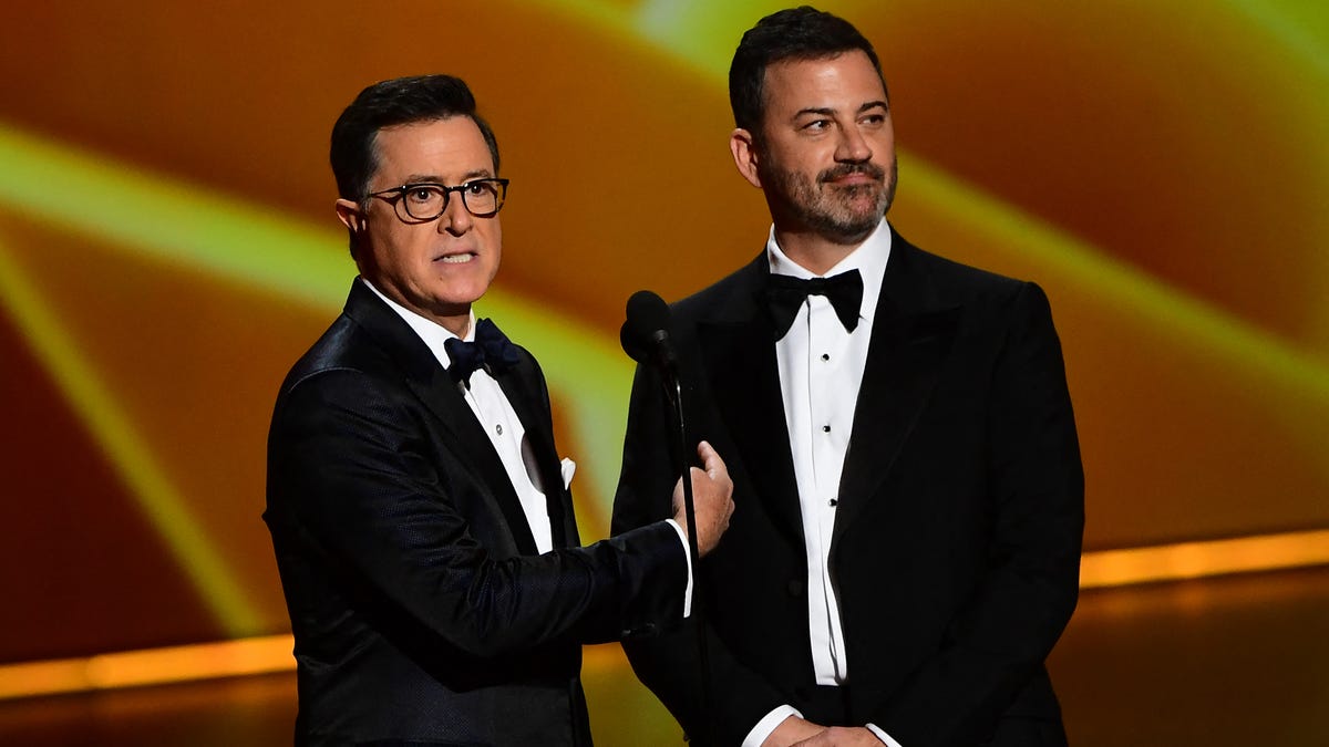 Stephen Colbert and Jimmy Kimmel speak onstage during the 71st Emmy Awards at the Microsoft Theatre in Los Angeles on Sept. 22, 2019.