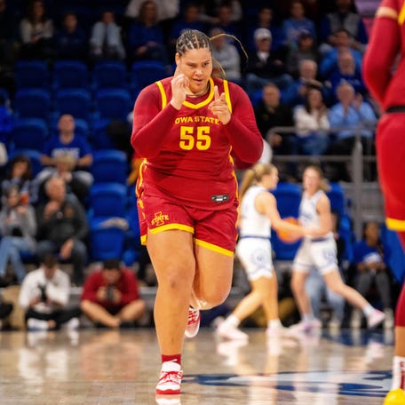 Iowa State's Audi Crooks (55) celebrates a basket.