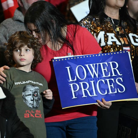 People listen as President Donald Trump delivers remarks on the economy in Mount Pocono, Pennsylvania, on Dec. 9, 2025.