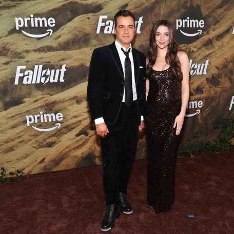 Justin Theroux and Nicole Brydon Bloom attend the "Fallout" season two red carpet premiere event at the Academy Museum of Motion Pictures on Dec. 8, 2025, in Los Angeles.