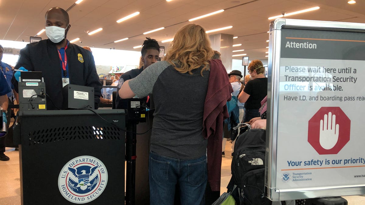 A U.S. Department of Homeland Security officer at the Fort Lauderdale-Hollywood International Airport in Fort Lauderdale, Florida, on March 15, 2020.