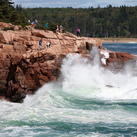 BAR HARBOR, MAINE - SEPTEMBER 15: People watch as waves break ashore in Acadia National Park before the possible arrival of Hurricane Lee on September 15, 2023 in Bar Harbor, Maine. Most of Maine is now in a Tropical Storm warning as Lee continues its path up the coastline. Forecasters say it will remain large and dangerous. (Photo by Joe Raedle/Getty Images)