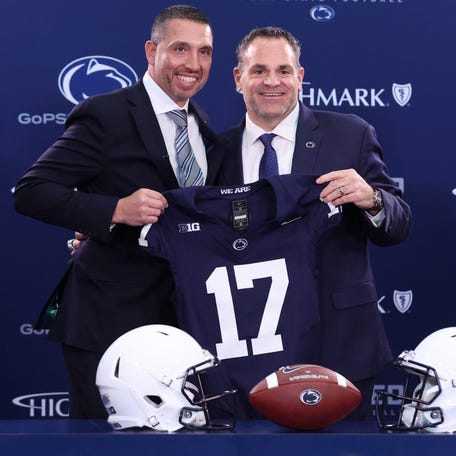 Penn State football coach Matt Campbell, left, and athletic director Pat Kraft pose for a photo after Campbell is announced as the school's new coach during a press conference at the Beaver Stadium Press Room.