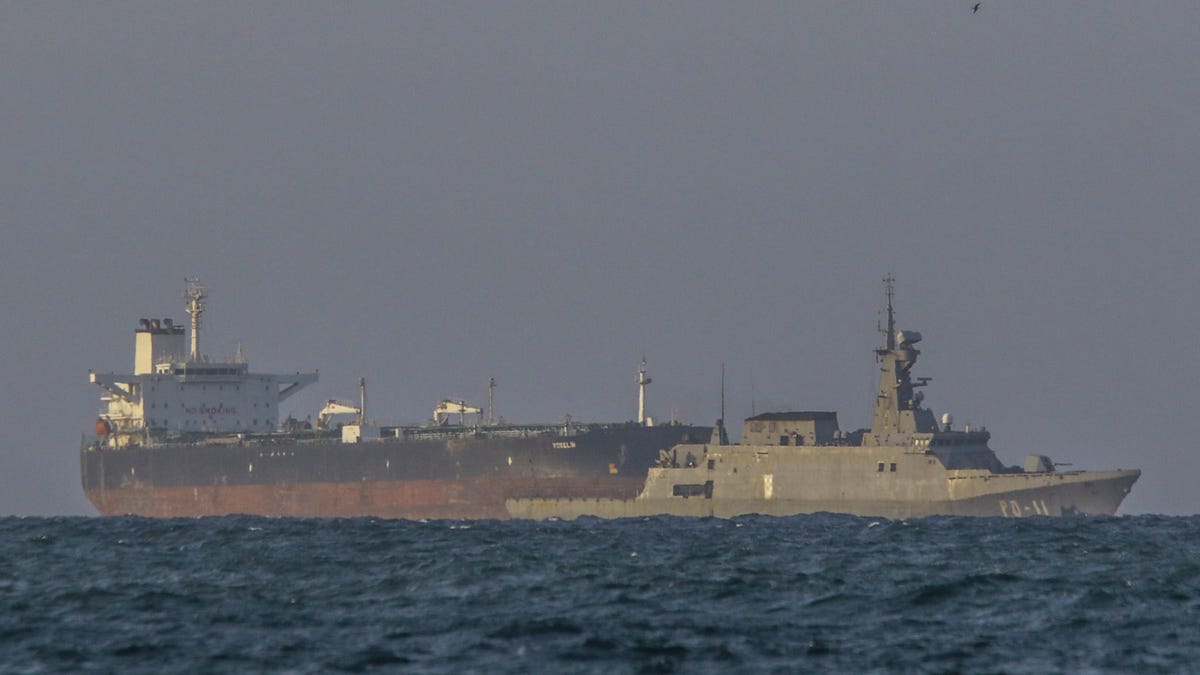 A Venezuelan navy patrol boat escorts Panamanian-flagged crude oil tanker Yoselin near the El Palito refinery in Puerto Cabello, Venezuela on Nov. 11, 2025. This happened after Venezuela announced what it called a major, nationwide military deployment to counter the U.S. naval presence off its coast.