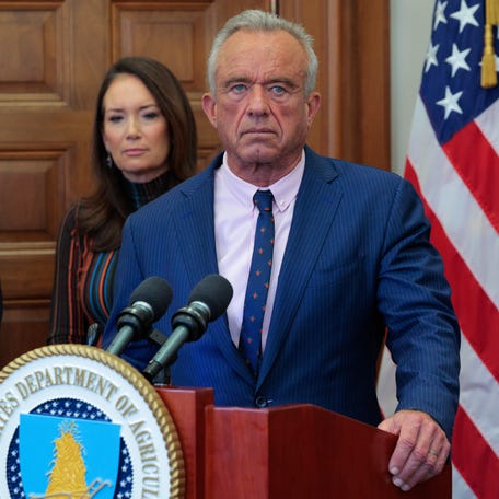 Health and Human Services Secretary Robert F. Kennedy Jr., joined by Agriculture Secretary Brooke Rollins and California farmer Blake Alexander on Dec. 10, 2025, in Washington, DC, announces a $700 million regenerative pilot program for farmers.