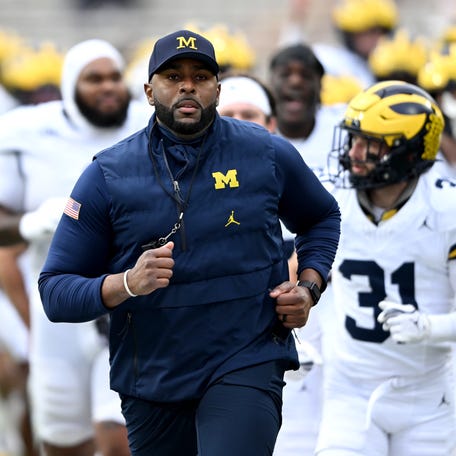 COLLEGE PARK, MARYLAND - NOVEMBER 22: Head coach Sherrone Moore of the Michigan Wolverines leads his team off the field after warm-up before the game against the Maryland Terrapins at SECU Stadium on November 22, 2025 in College Park, Maryland. (Photo by Greg Fiume/Getty Images)