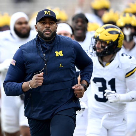 COLLEGE PARK, MARYLAND - NOVEMBER 22: Head coach Sherrone Moore of the Michigan Wolverines leads his team off the field after warm-up before the game against the Maryland Terrapins at SECU Stadium on November 22, 2025 in College Park, Maryland. (Photo by Greg Fiume/Getty Images)