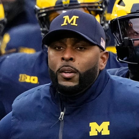 Michigan Wolverines head coach Sherrone Moore leads his team onto the field prior to the NCAA football game against the Ohio State Buckeyes at Michigan Stadium in Ann Arbor, Mich. on Nov. 29, 2025.