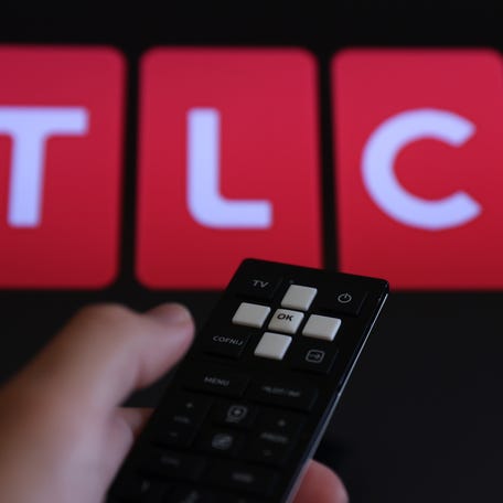 TLC logo displayed on a tv screen.