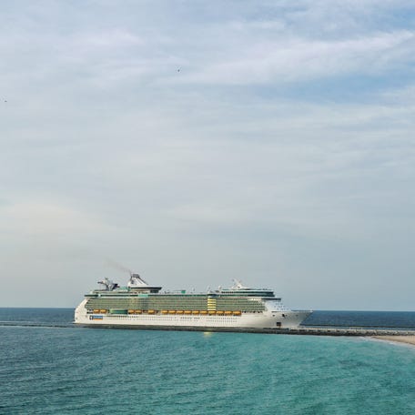 An aerial drone view as Royal Caribbean's Liberty of the Seas ship passes South Beach on its way to the Port of Miami on May 19, 2020.