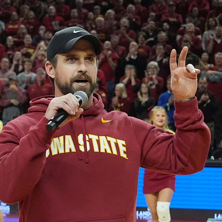 Iowa State football coach Jimmy Rogers speaks during a timeout in the Cy-Hawk men's basketball game on Dec. 11, 2025, at Hilton Coliseum in Ames.