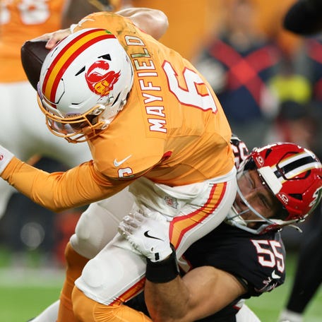 Dec 11, 2025; Tampa, Florida, USA; Atlanta Falcons linebacker Kaden Elliss (55) sacks Tampa Bay Buccaneers quarterback Baker Mayfield (6) during the first quarter at Raymond James Stadium. Mandatory Credit: Nathan Ray Seebeck-Imagn Images