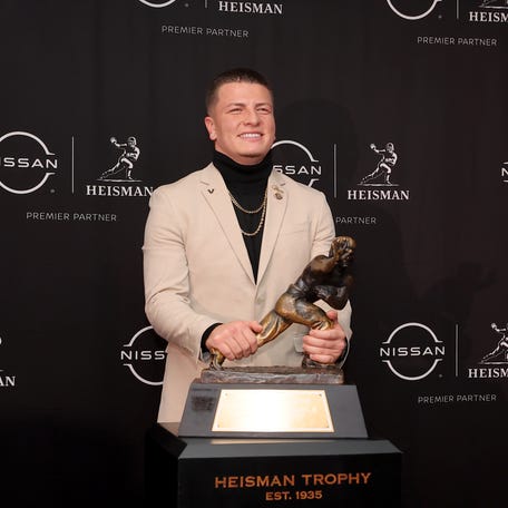 Dec 13, 2025; New York, NY, USA; Vanderbilt Commodores quarterback Diego Pavia poses with the Heisman trophy during a press conference at the New York Marriott Marquis. Mandatory Credit: Brad Penner-Imagn Images
