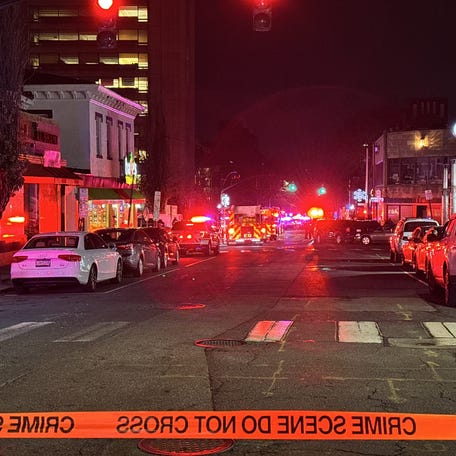 At Angel and Thayer, police rope off the scene as they continue to search for the suspect of a shooting at Brown University