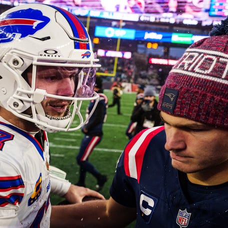 New England Patriots quarterback Drake Maye (10) meets Buffalo Bills quarterback Josh Allen (17) on the field after the game at Gillette Stadium.