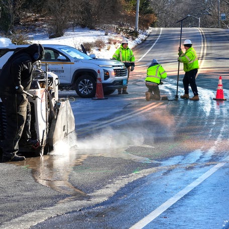 City workers at the scene of a water main break on Jamesbury Drive and Salisbury Street.