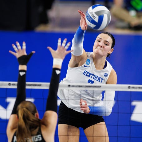 Kentucky outside hitter Eva Hudson (7) attacks the ball during the second set against Cal Poly.