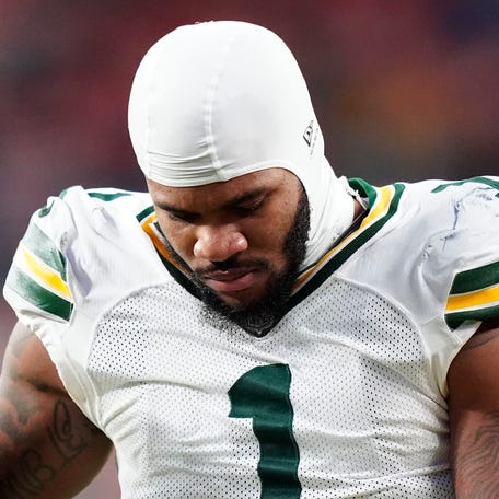 Dec 14, 2025; Denver, Colorado, USA; Green Bay Packers defensive end Micah Parsons (1) walks off the field with help from medical personnel following an injury during the third quarter against the Denver Broncos at Empower Field at Mile High. Mandatory Credit: Ron Chenoy-Imagn Images