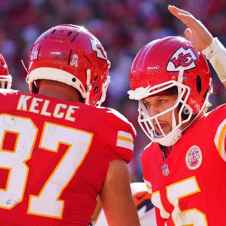 Nov 10, 2024; Kansas City, Missouri, USA; Kansas City Chiefs tight end Travis Kelce (87) celebrates with quarterback Patrick Mahomes (15) after scoring against the Denver Broncos during the first half at GEHA Field at Arrowhead Stadium. Mandatory Credit: Denny Medley-Imagn Images