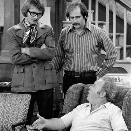 In the 1971 "All in the Family" episode "Judging Books by Covers," Anthony Geary, left, stars as Roger, alongside Rob Reiner as Michael Stivic and Carroll O'Connor as Archie Bunker.