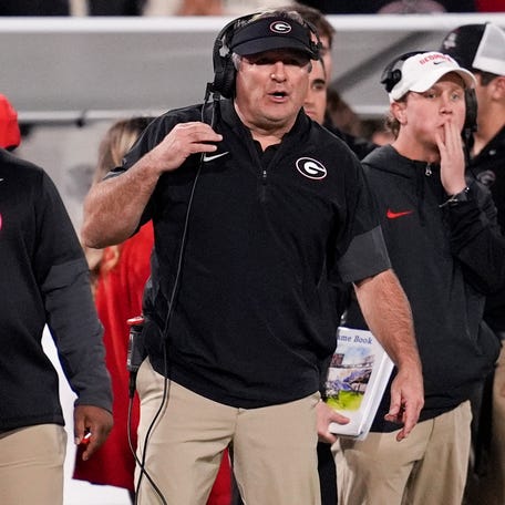 Georgia football coach Kirby Smart looks on during the first half of his team's game against Texas at Sanford Stadium.