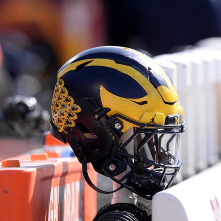 Oct 12, 2019; Champaign, IL, USA; A Michigan Wolverines helmet sits on the back of the bench during the second half of the game against the Illinois Fighting Illini at Memorial Stadium. Mandatory Credit: Michael Allio-USA TODAY Sports