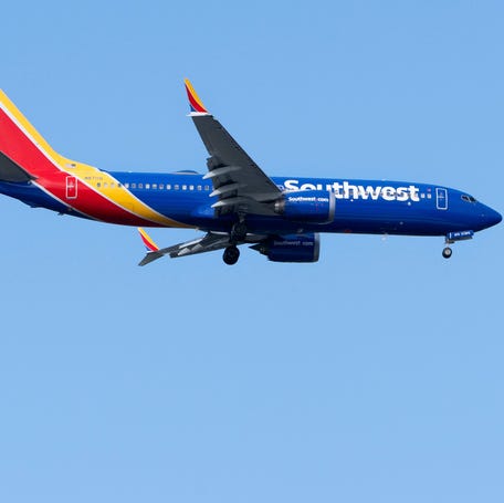 A Southwest airlines jet prepares to land at Palm Beach International Airport on December 1, 2025, in West Palm Beach, Florida.