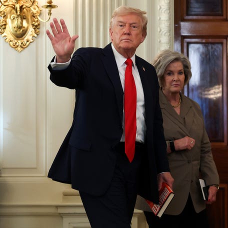 President Donald Trump departs with White House Chief of Staff Susie Wiles following a roundtable discussion in the State Dining Room of the White House on October 08, 2025 in Washington, DC.