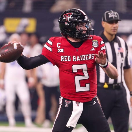 Texas Tech's Behren Morton prepares to throw against BYU during the Big 12 Conference championship football game, Saturday, Nov. 6, 2025, at AT&T Stadium in Arlington.