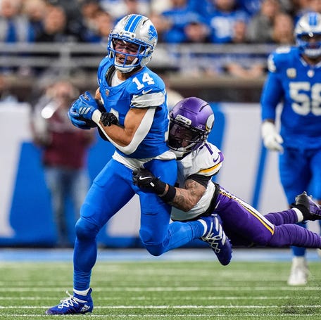 Detroit Lions wide receiver Amon-Ra St. Brown (14) makes a catch against Minnesota Vikings cornerback Byron Murphy Jr. (7) during the second half at Ford Field in Detroit on Sunday, November 2, 2025.