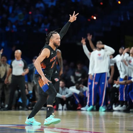New York Knicks guard Jalen Brunson (11) reacts after making a 3-pointer against the San Antonio Spurs during the NBA Cup final.