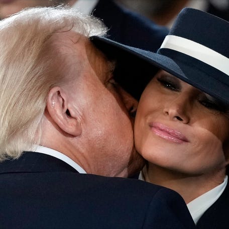 President Donald Trump kisses first lady Melania Trump after he was sworn in during the 60th Presidential Inauguration in the Rotunda of the U.S. Capitol in Washington, Monday, Jan. 20, 2025.