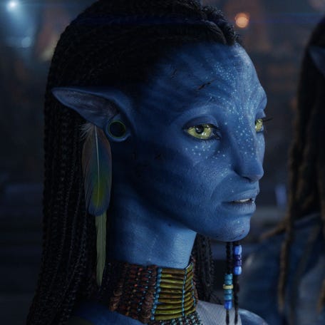 Neytiri (Zoe Saldaña, left) and Jake Sully (Sam Worthington) survive another battle with the Sky People by the end of "Avatar: Fire and Ash."